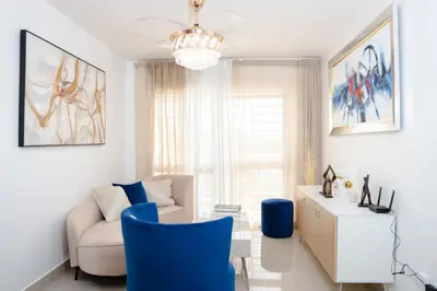 a living room with a couch and a chair at apartamento vacacional BANI in Boca Canasta