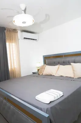 a bedroom with a bed with a white towel on it at apartamento vacacional BANI in Boca Canasta