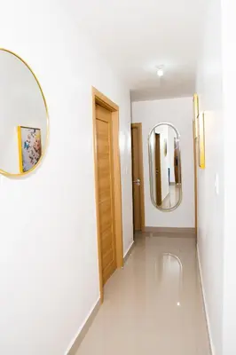 a room with two mirrors and a hallway at apartamento vacacional BANI in Boca Canasta
