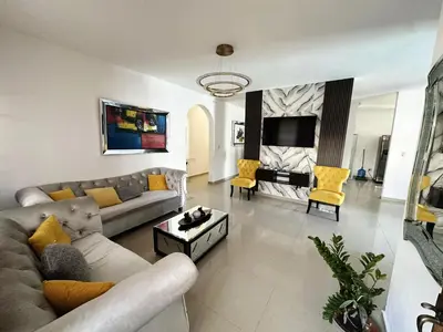 a living room with a couch and a table at villa fortuna in Nagua