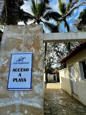 a sign on the side of a building with a plane at JuanDolio Penthouse 3 bedrooms Beachfront frente a hemingway in Los Corrales