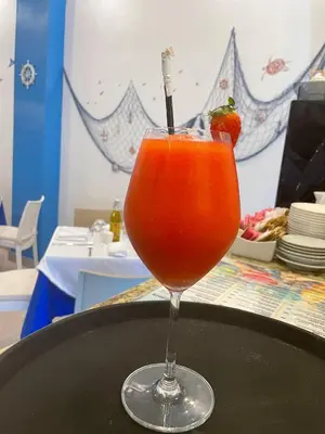 a drink in a glass sitting on a table at Ristorante simaredo in Punta Cana