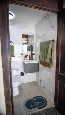 a bathroom with a toilet and a sink at Penthouse in Santo Domingo