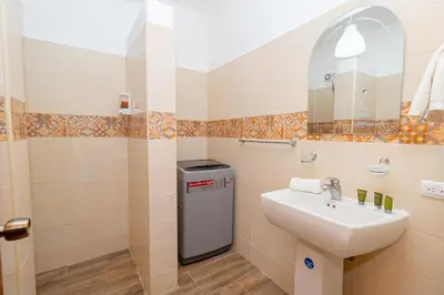 a bathroom with a sink and a mirror at Luxury 1BR Oasis Paraiso Residence Bayahibe