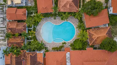 an overhead view of a swimming pool at a resort at Luxury 1BR Oasis Paraiso Residence Bayahibe