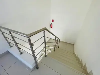 a staircase in a building with a fire hydrant on the wall at Beautiful Penthouse in Sunset Puerto Plata Gym, Pool in Puerto Plata