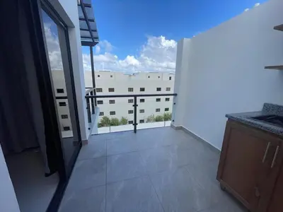 a balcony with a view of a building at Beautiful Penthouse in Sunset Puerto Plata Gym, Pool in Puerto Plata