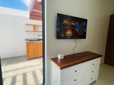 a room with a white dresser with a counter at Beautiful Penthouse in Sunset Puerto Plata Gym, Pool in Puerto Plata