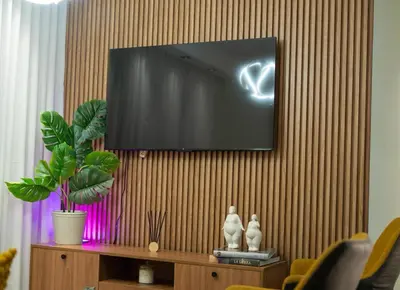 a flat screen tv hanging on a wall at San Isidro Urban suite in Juan López