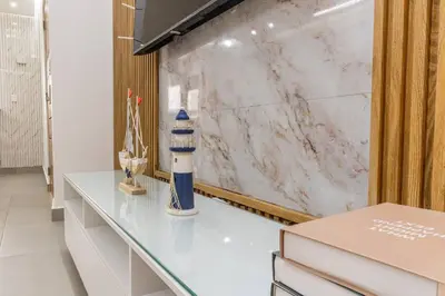 a dressing room with a lighthouse vase on a counter at Caribey 200 meters from Punta Popy beach in Las Terrenas