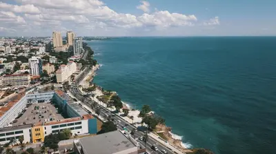 an aerial view of a city and the ocean at Modern Central Ocean View and Jacuzzi Apartment in Santo Domingo
