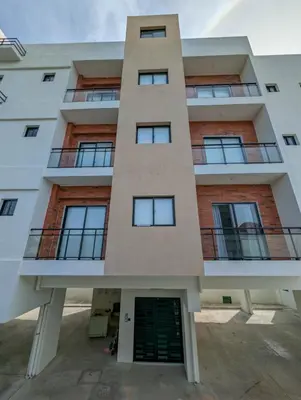 an external view of a building at Prado Garden Hotel in Monte Plata