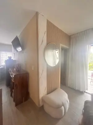 a living room with a chair and a table at El descanso in Mata Chalupe