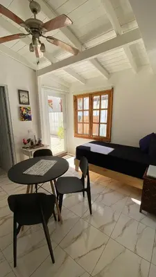 a bedroom with a bed and a table and chairs at Casa Mattia in La Laguna
