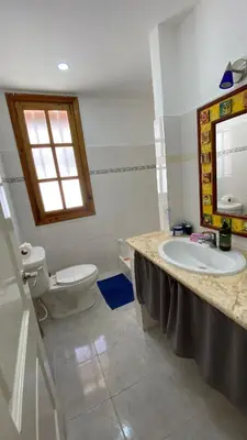 a bathroom with a sink and a toilet at Casa Mattia in La Laguna