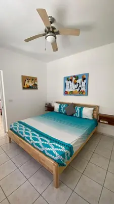 a bedroom with a bed with a ceiling fan at Casa Mattia in La Laguna