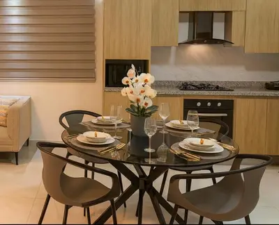a dining room table with chairs and flowers on it at Boca chica playa y sol in Boca Chica