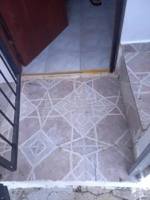 a tile floor with a design on it at Casa Petter og Maria first floor in Santiago de los Caballeros