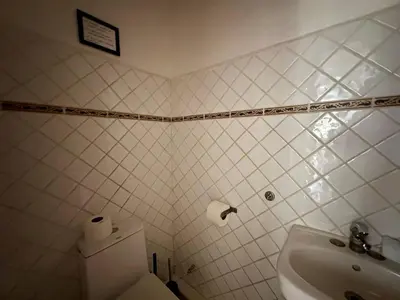 a bathroom with a toilet and a sink at Casa Siete Las Terrenas in Las Terrenas