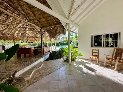 an open pavilion with a pool in a resort at Casa Siete Las Terrenas in Las Terrenas