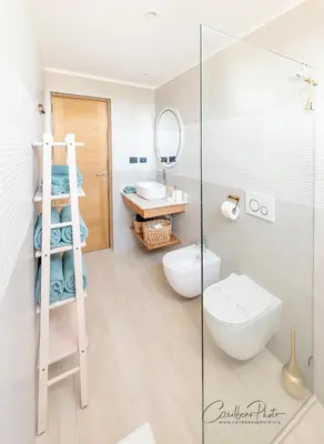 a bathroom with a toilet and a sink and a mirror at Estrella Garden Shaula 301 New Modern Penthouse in La Laguna