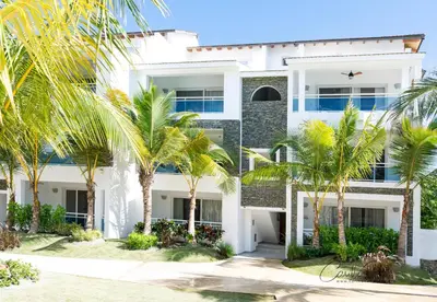 an exterior view of a white building with palm trees at Estrella Garden Shaula 301 New Modern Penthouse in La Laguna