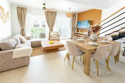 a living room with a table and a couch at Estrella Garden Shaula 304 New Modern Penthouse in La Laguna