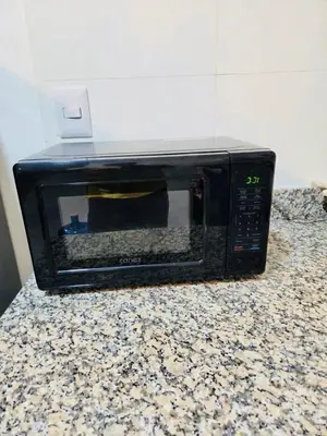 a microwave sitting on top of a counter at Comfortable and warm apartment in Higuey