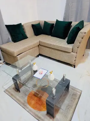 a living room with a couch and a glass table at Comfortable and warm apartment in Higuey
