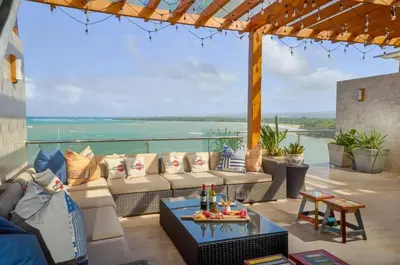 a living room with a couch and a table at Increíble ático de lujo con impresionantes vistas in Puerto Plata