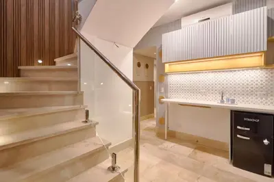 a lobby with stairs and a counter in a building at Increíble ático de lujo con impresionantes vistas in Puerto Plata