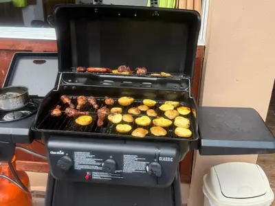 a grill with a bunch of food on it at Casa vista hermosa in Camú
