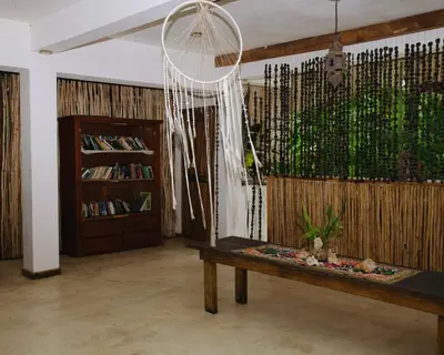 a room with a table with a plant on it at Ganesh Village Community in Colorado