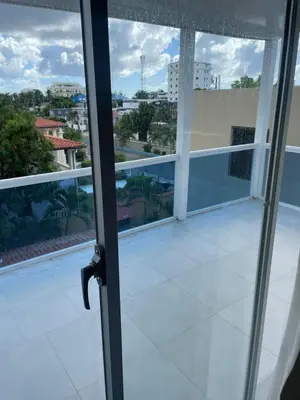 a sliding glass door with a view of a balcony at Zile Hotel in Boca Chica