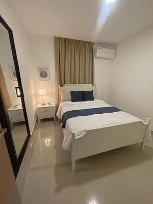 a white bedroom with a bed and a window at Apartamento en La Romana 3 habitaciones in La Romana