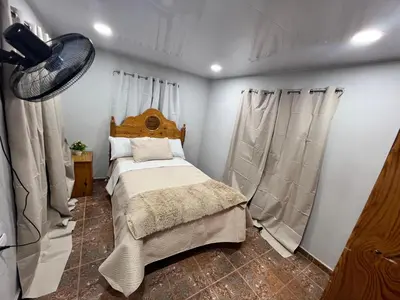 a bedroom with a bed in a room at La Casita in Vicente Noble