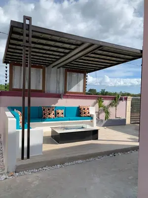 a pavilion with a blue and white couch under awning at Terra Mia Villa in Pedernales