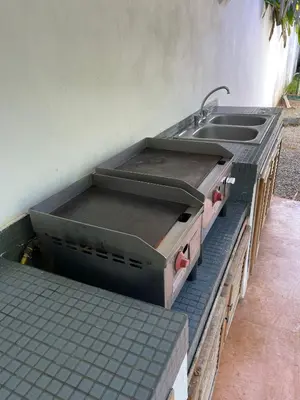 an outdoor kitchen with two sinks and a sink at Villa Louana in Las Terrenas