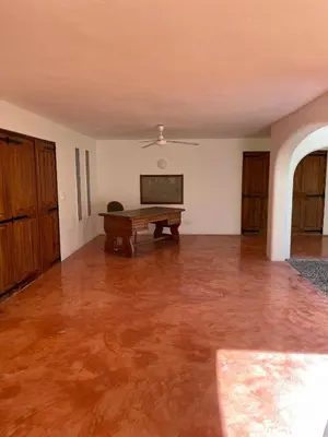 an empty room with a ping pong table in it at Villa Louana in Las Terrenas