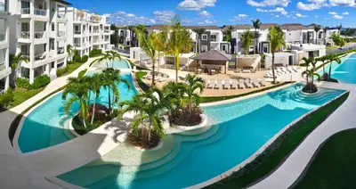 an aerial view of a resort pool with palm trees at Green Oasis in La Laguna
