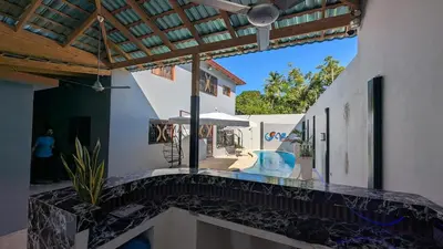 a house with a balcony with a swimming pool at Villa soñada 1 in Sosua