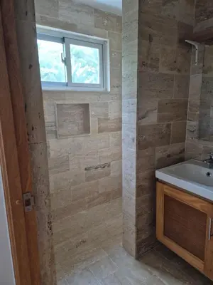 a bathroom with a sink and a window at Jardines de Montserrat - Lux, Rooftop, 3Bds, near beach in Las Terrenas