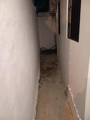 an empty hallway with a white wall and a floor at Casa Petter and Maria, 2end floor in Santiago de los Caballeros