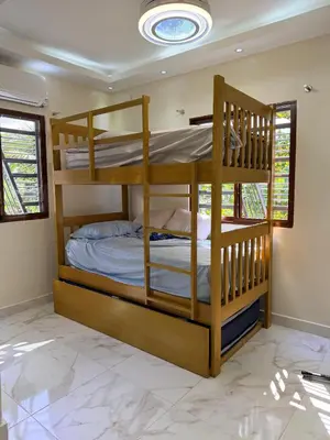a bedroom with two bunk beds in a room at Villa Rafael in Bayaguana