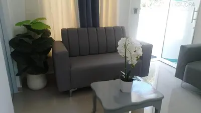 a living room with a couch and a table at Hotel a 500 de la playa in Pedernales