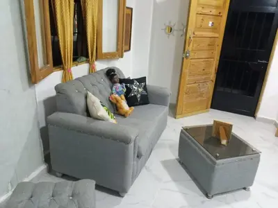 a person laying on a couch in a living room at The Colonial Corner in Colorado