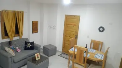 a living room with a couch and a table at The Colonial Corner in Colorado
