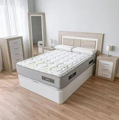 a bed in a bedroom with two night stands and two tables at Recidencial in Mendoza