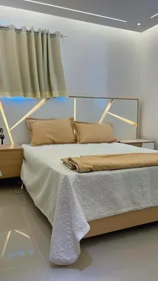 a bedroom with a large bed with a window at Apartment in the heart of Santiago in Santiago de los Caballeros