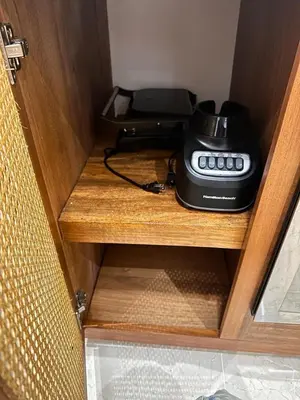 a phone sitting on top of a wooden cabinet at Villa Coral Blue in Playa Bonita in Las Terrenas